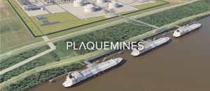Aerial view of ships at port near Plaquemines industrial facility with green fields and storage tanks.